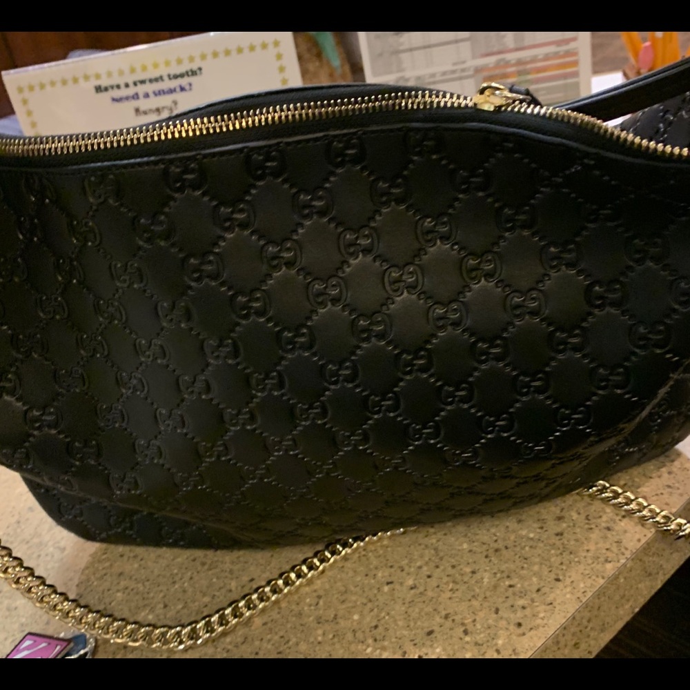 I have an adorable black Gucci signature large bag